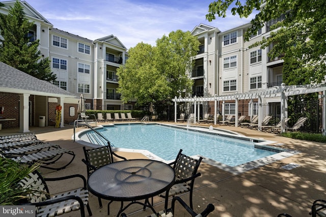 12958 Centre Park Cir Unit 219, Herndon, VA 20171 - community pool with a pergola and a patio