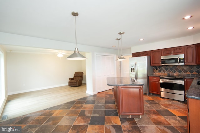 5470 Moose Lodge Rd, Cambridge, MD 21613 - kitchen with stainless steel appliances, recessed lighting, tasteful backsplash, a center island, and pendant lighting