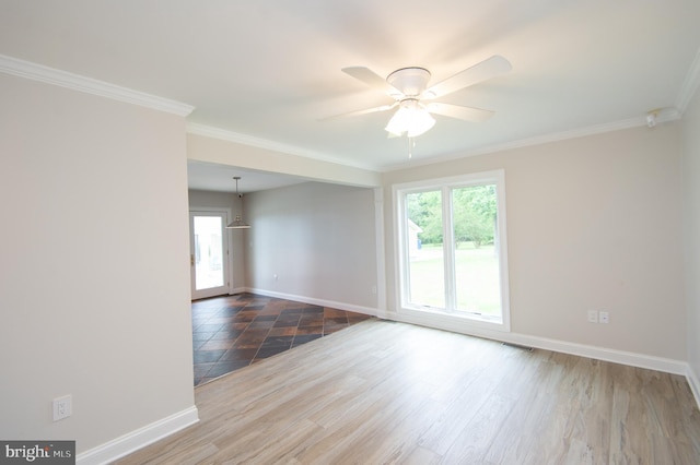 5470 Moose Lodge Rd, Cambridge, MD 21613 - unfurnished room featuring plenty of natural light, crown molding, ceiling fan, and wood finished floors