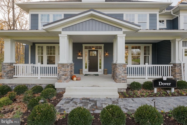 0006 Copperleaf Blvd, Hanover, MD 21076 - doorway to property featuring covered porch and stone siding