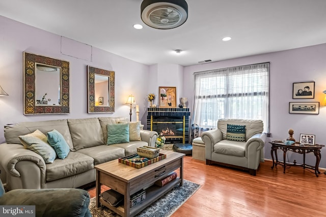 2054 Harbour Dr, Palmyra, NJ 08065 - living room featuring wood finished floors, recessed lighting, and a tiled fireplace