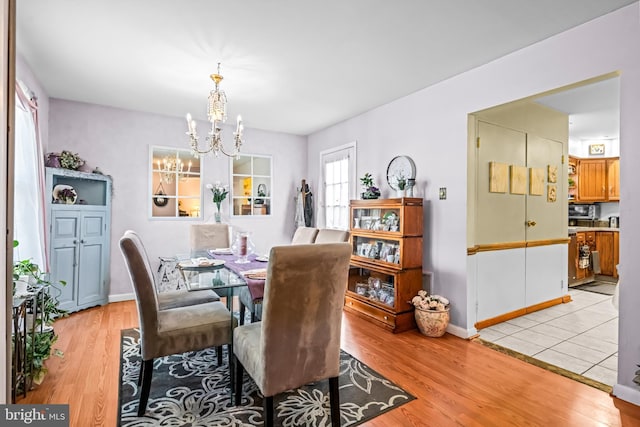 2054 Harbour Dr, Palmyra, NJ 08065 - dining space with a chandelier and light wood-type flooring