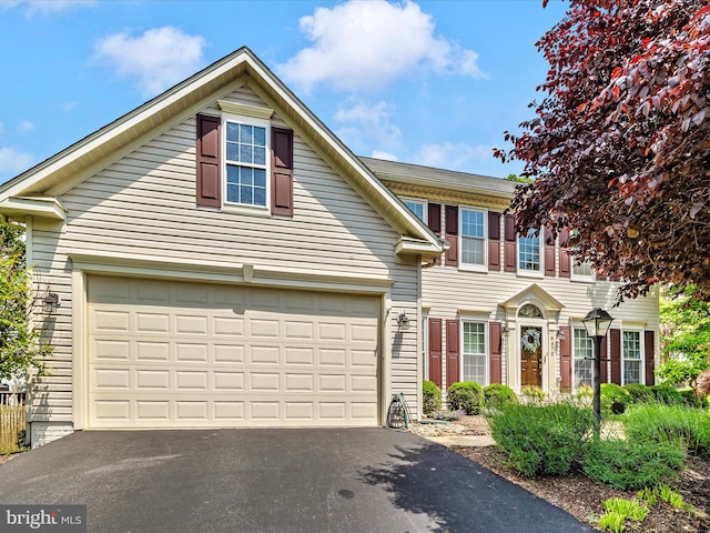 6470 Saddlebrook Ln, Frederick, MD 21701 - view of front facade with asphalt driveway and a garage