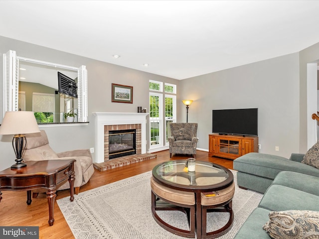 6470 Saddlebrook Ln, Frederick, MD 21701 - living room with wood finished floors, a fireplace, and recessed lighting