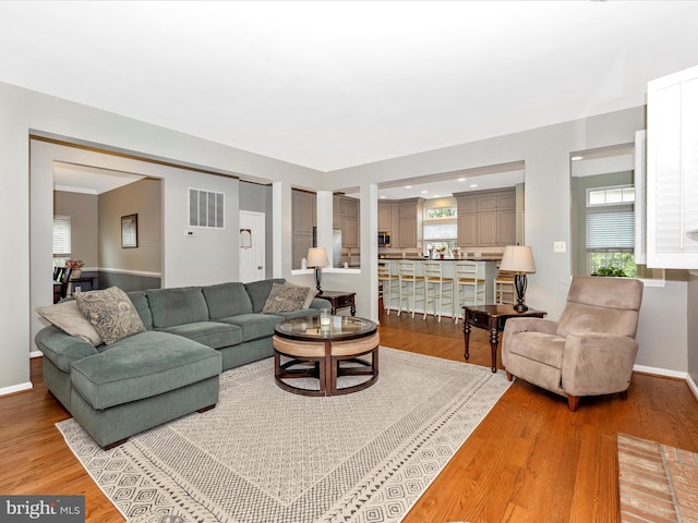 6470 Saddlebrook Ln, Frederick, MD 21701 - living area featuring light wood-style flooring and baseboards