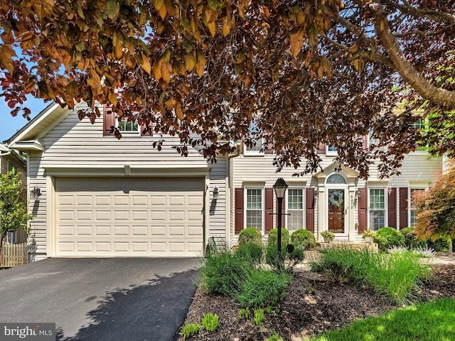 6470 Saddlebrook Ln, Frederick, MD 21701 - view of property hidden behind natural elements featuring driveway and an attached garage