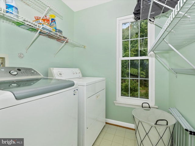 6470 Saddlebrook Ln, Frederick, MD 21701 - washroom with separate washer and dryer, radiator, baseboards, and healthy amount of natural light