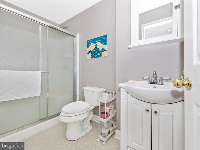 6470 Saddlebrook Ln, Frederick, MD 21701 - bathroom featuring a shower stall, toilet, vanity, and tile patterned floors