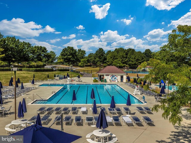 6470 Saddlebrook Ln, Frederick, MD 21701 - community pool with a patio and fence