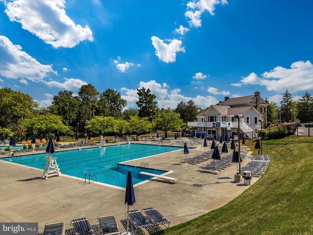 6470 Saddlebrook Ln, Frederick, MD 21701 - community pool featuring a yard, a patio area, and view of wooded area