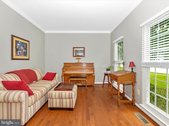 6470 Saddlebrook Ln, Frederick, MD 21701 - living area featuring ornamental molding, wood finished floors, plenty of natural light, and baseboards