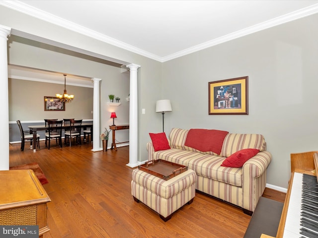 6470 Saddlebrook Ln, Frederick, MD 21701 - living room featuring ornate columns, a chandelier, crown molding, wood finished floors, and baseboards