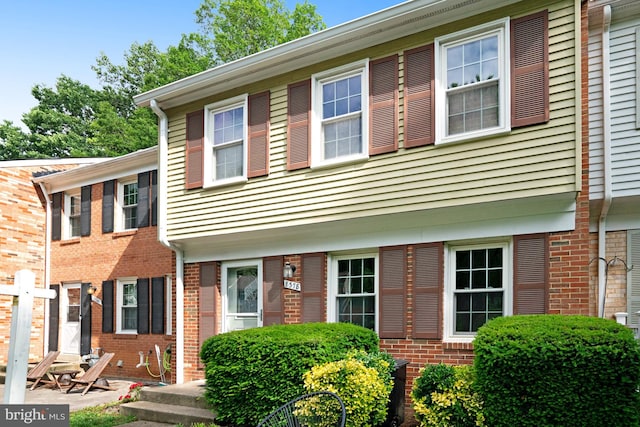 view of front of house with brick siding