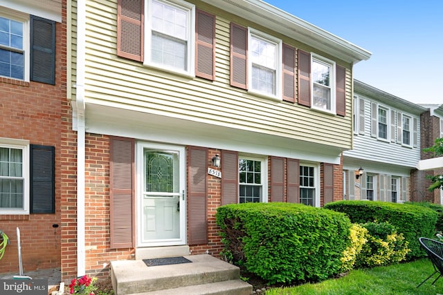 view of front of home with brick siding