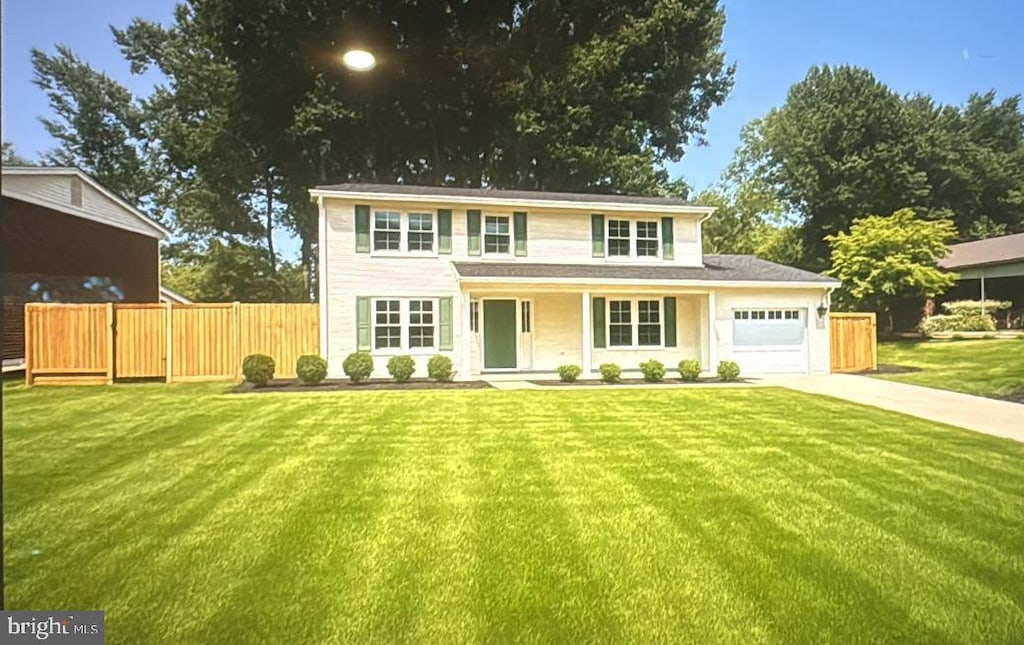 4766 Tapestry Dr, Fairfax, VA 22032 - view of front of property with an attached garage, concrete driveway, and covered porch