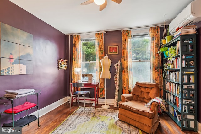 1132 Roland Heights Ave, Baltimore, MD 21211 - living area featuring a wall mounted AC, ceiling fan, healthy amount of natural light, and baseboards