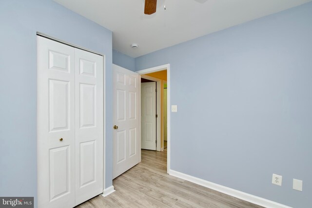 10305 Butternut Cir, Manassas, VA 20110 - unfurnished bedroom featuring baseboards, a closet, light wood-style flooring, and a ceiling fan