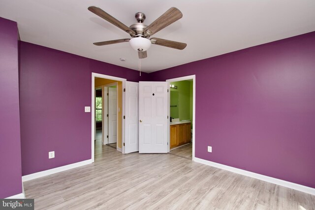 10305 Butternut Cir, Manassas, VA 20110 - unfurnished bedroom with light wood-style floors, baseboards, ensuite bathroom, and a ceiling fan