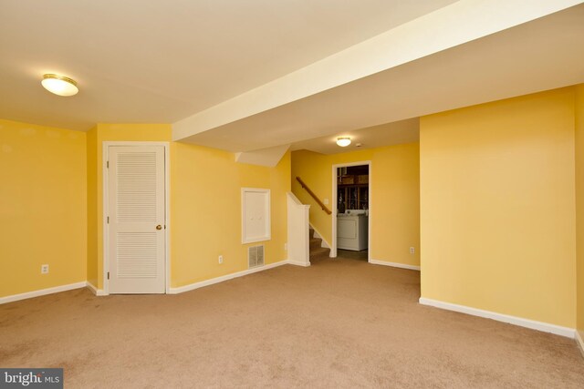 10305 Butternut Cir, Manassas, VA 20110 - carpeted empty room with washer / dryer, stairway, and baseboards