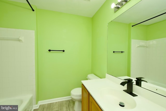 10305 Butternut Cir, Manassas, VA 20110 - full bathroom with toilet, vanity, baseboards, shower / bath combination, and wood finished floors