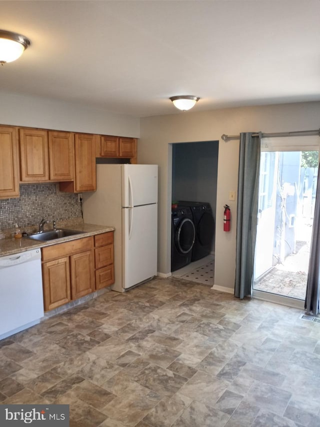 28 Ridgewood Pl, Willingboro, NJ 08046 - kitchen with white appliances, a sink, washer and clothes dryer, tasteful backsplash, and stone finish floors