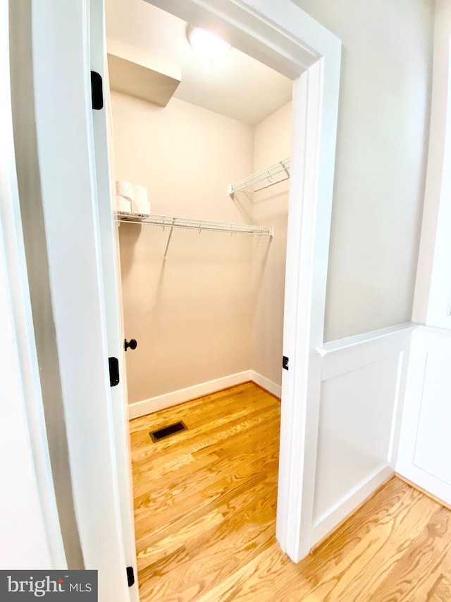 spacious closet with light wood-type flooring