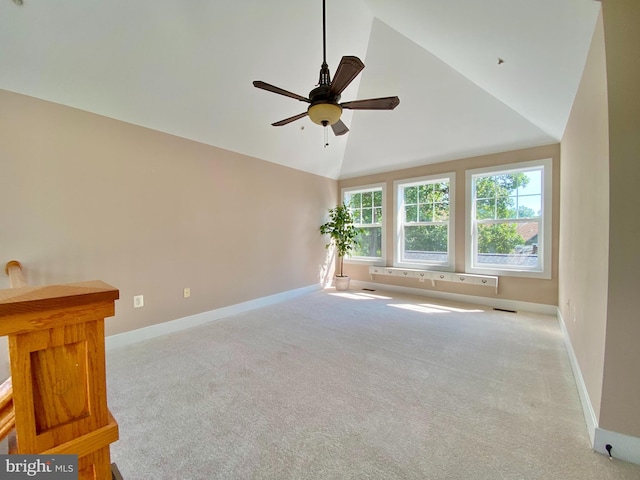 unfurnished room featuring a ceiling fan, carpet floors, baseboards, and high vaulted ceiling