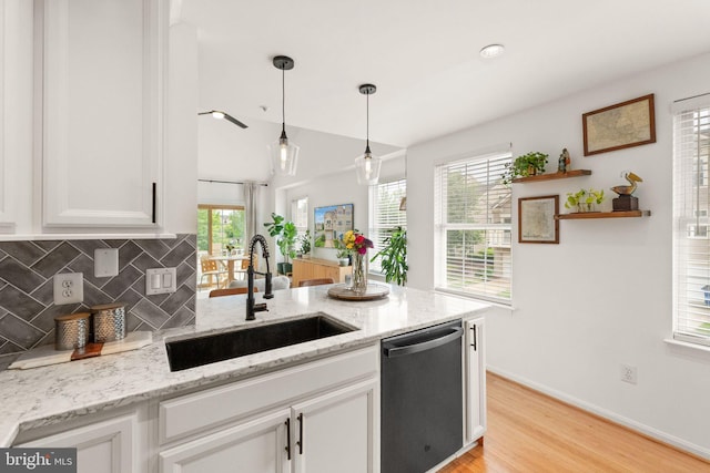 20387 Birchmere Ter, Ashburn, VA 20147 - kitchen with stainless steel dishwasher, a sink, white cabinetry, and light stone countertops