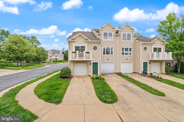 20387 Birchmere Ter, Ashburn, VA 20147 - view of property with driveway, an attached garage, and a balcony