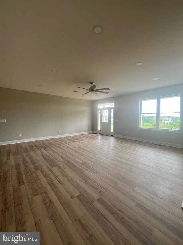607 Slonaker Ln, Martinsburg, WV 25405 - empty room with wood finished floors, ceiling fan, and recessed lighting