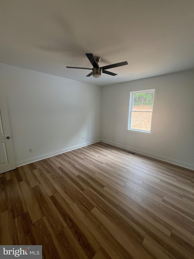 607 Slonaker Ln, Martinsburg, WV 25405 - spare room with wood finished floors and ceiling fan