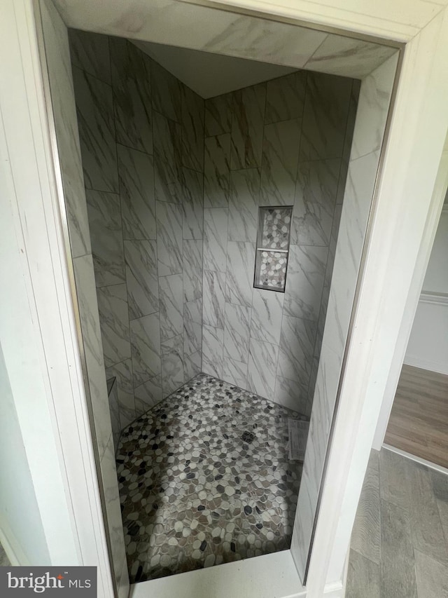 607 Slonaker Ln, Martinsburg, WV 25405 - full bathroom featuring a tile shower and wood finished floors