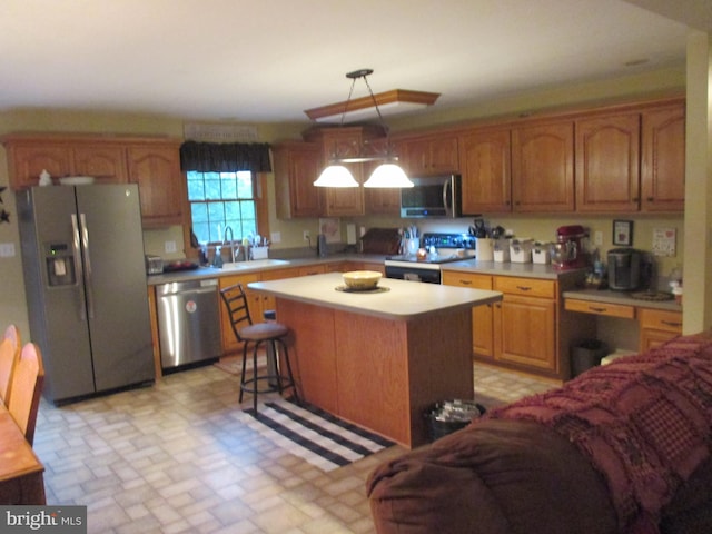 151 Juniper Dr, Ridgeley, WV 26753 - kitchen with stainless steel appliances, light countertops, a center island, and brown cabinets