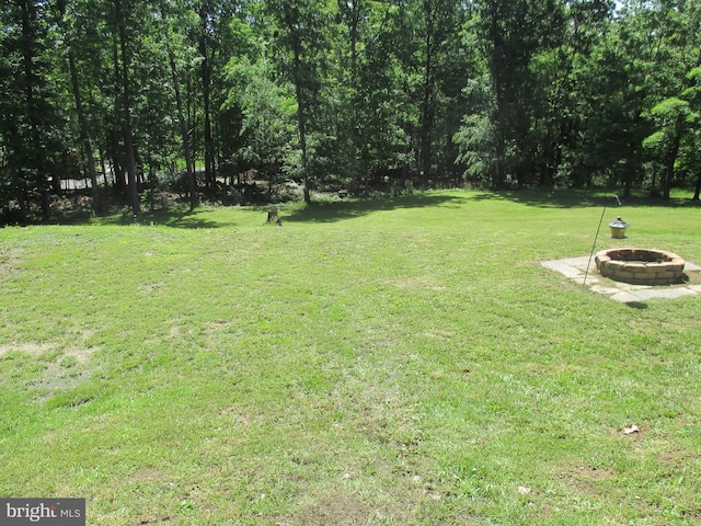 151 Juniper Dr, Ridgeley, WV 26753 - view of grassy yard with a fire pit