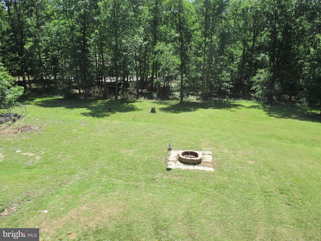 151 Juniper Dr, Ridgeley, WV 26753 - view of grassy yard featuring a fire pit