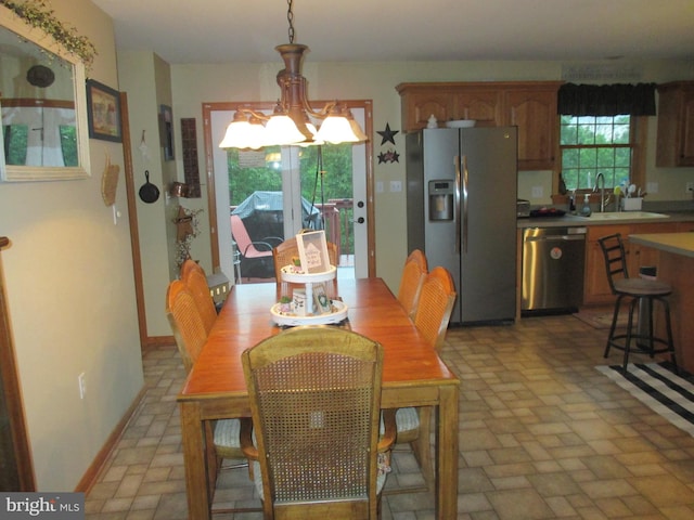 151 Juniper Dr, Ridgeley, WV 26753 - dining space with brick patterned flooring and a chandelier