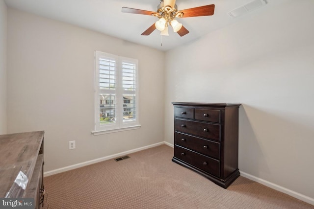 bedroom with light carpet and baseboards