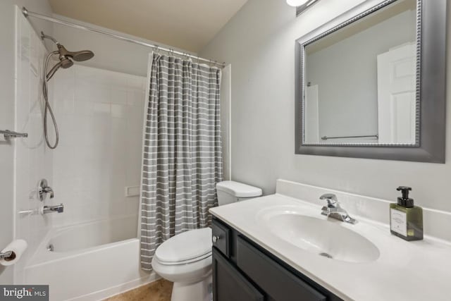 full bath featuring toilet, vanity, and shower / tub combo