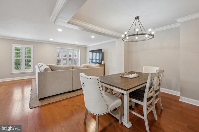 dining area featuring crown molding, a chandelier, recessed lighting, hardwood / wood-style flooring, and baseboards