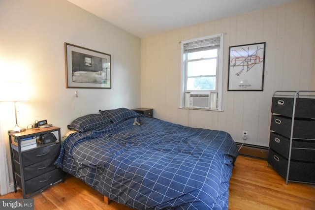715 Susquehanna Cir, Newark, DE 19711 - bedroom with a baseboard heating unit, wood finished floors, and cooling unit