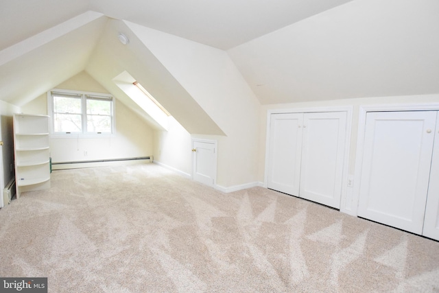 715 Susquehanna Cir, Newark, DE 19711 - additional living space with a baseboard radiator, vaulted ceiling, carpet, and baseboards