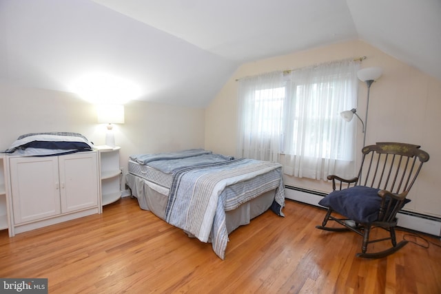 715 Susquehanna Cir, Newark, DE 19711 - bedroom featuring light wood finished floors, vaulted ceiling, and baseboard heating