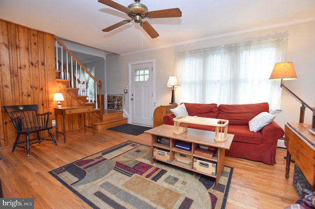 715 Susquehanna Cir, Newark, DE 19711 - living area with wood finished floors, stairway, ceiling fan, ornamental molding, and a baseboard heating unit