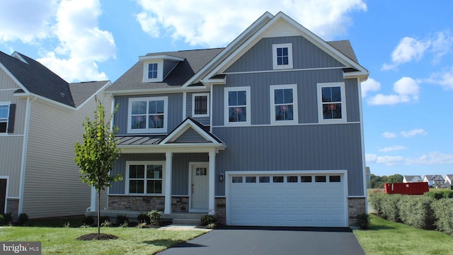116 Munsee Cir, Winchester, VA 22602 - craftsman inspired home with stone siding, driveway, an attached garage, a standing seam roof, and a front yard