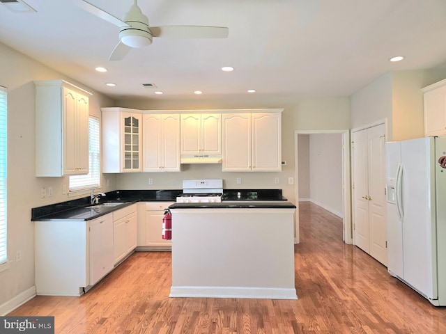 10 Honeyflower, Bordentown, NJ 08620 - kitchen with white appliances, a sink, light wood finished floors, under cabinet range hood, and glass insert cabinets