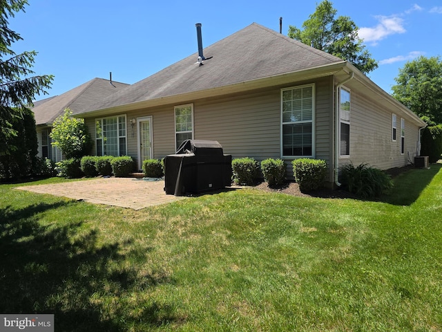 10 Honeyflower, Bordentown, NJ 08620 - back of property with a patio area, a lawn, and central AC