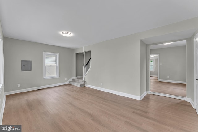 59 Jarvis St, Pemberton, NJ 08068 - empty room featuring light wood-type flooring, stairway, baseboards, and electric panel