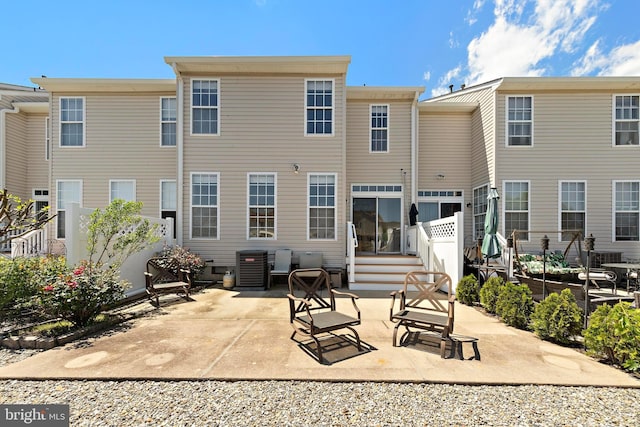 14 Osprey Ln, Bayville, NJ 08721 - back of property with central AC and a patio area