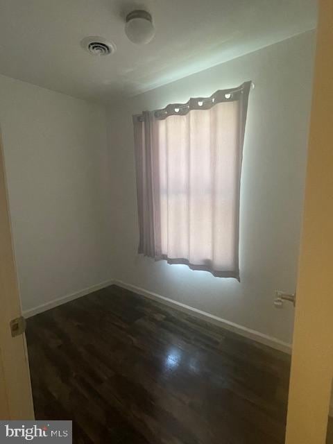 319 Crestmont St, Reading, PA 19611 - unfurnished room with plenty of natural light, baseboards, and dark wood-type flooring