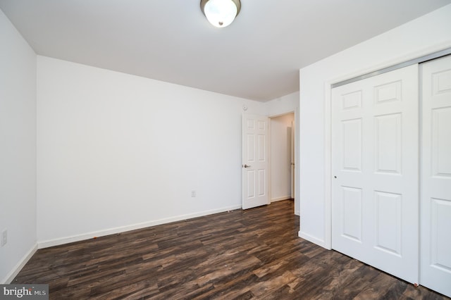 319 Crestmont St, Reading, PA 19611 - unfurnished bedroom with dark wood finished floors, baseboards, and a closet